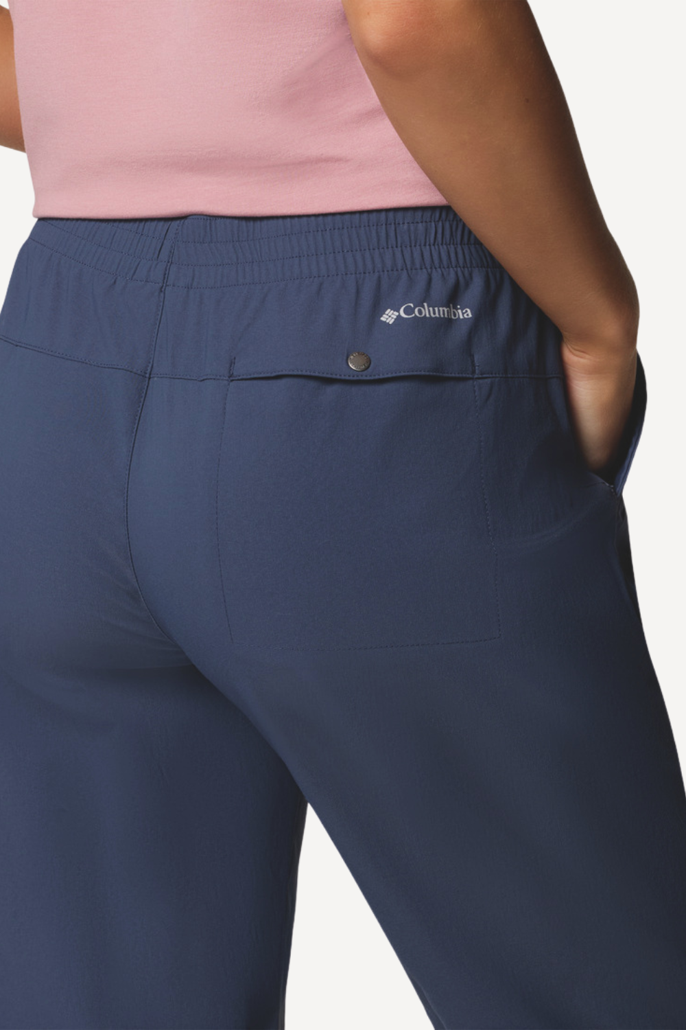 Pantalon anti-UV bleu UPF 50+ pour femme, avec taille extensible et poches pratiques, idéal pour les activités en plein air.