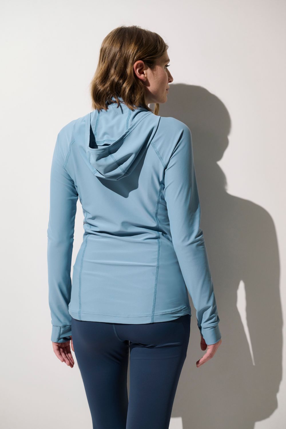 T-shirt de bain anti-UV - Galápagos pour femme, en lycra bleu, avec capuche et manches longues, idéal pour le paddle.