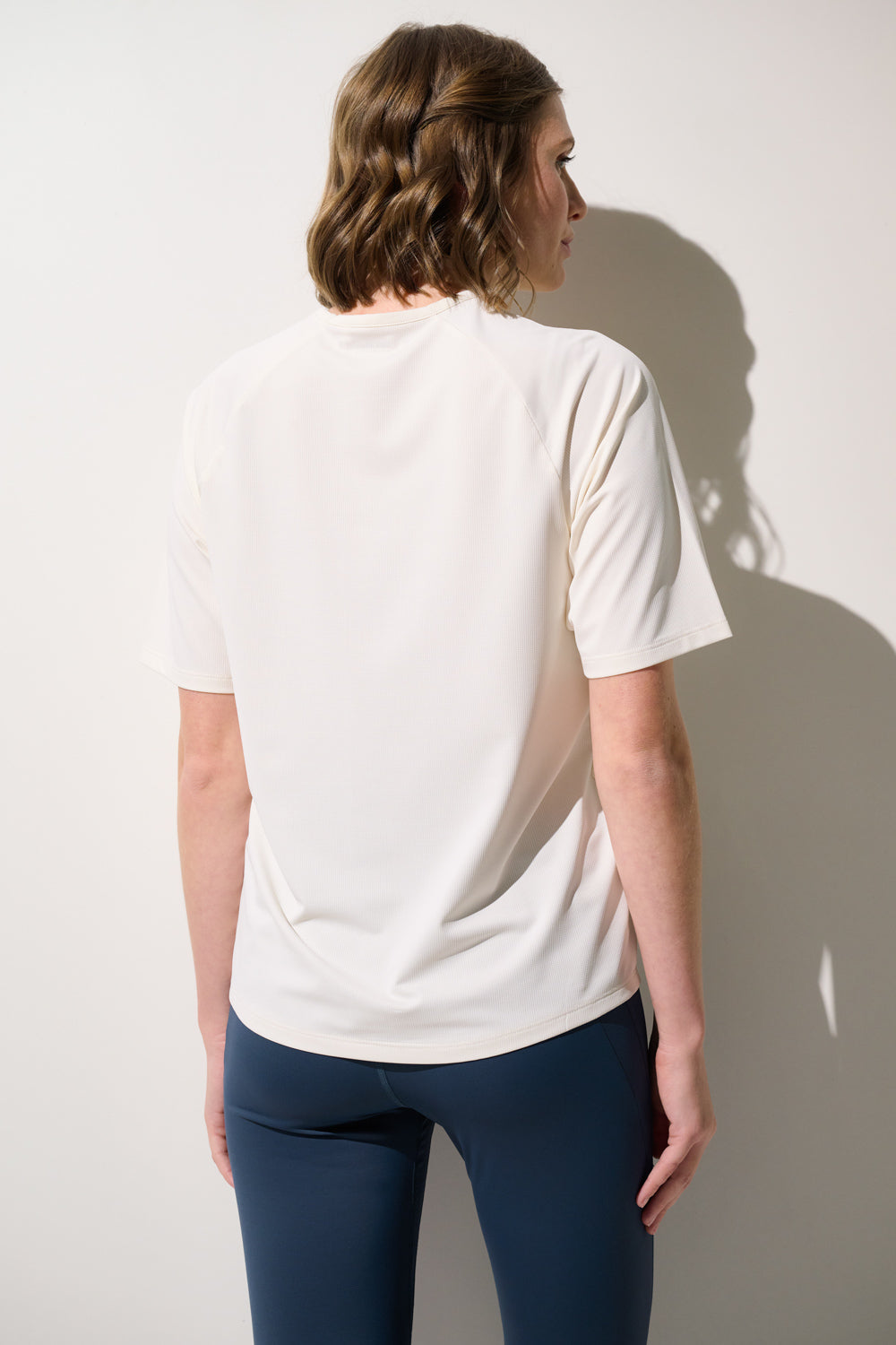 T-shirt anti-UV Boston blanc pour femme, léger et respirant, idéal pour le sport avec protection UPF 50+.