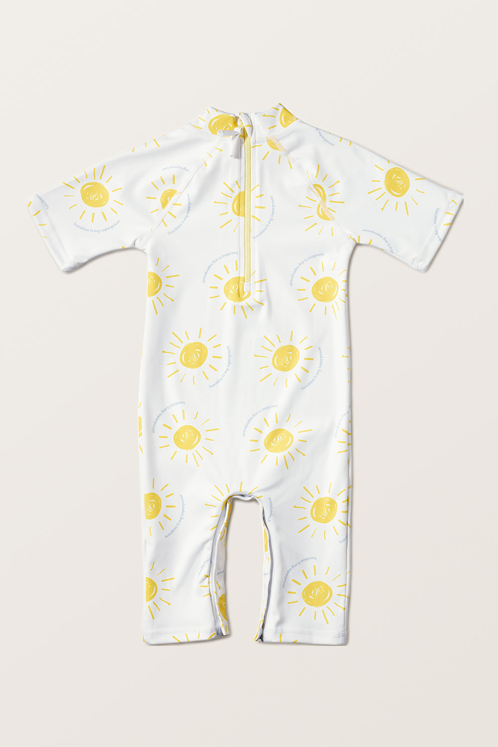Combinaison de bain anti-UV - Pacific, blanc avec motifs soleil, UPF 50+ pour bébé, idéale pour la plage.